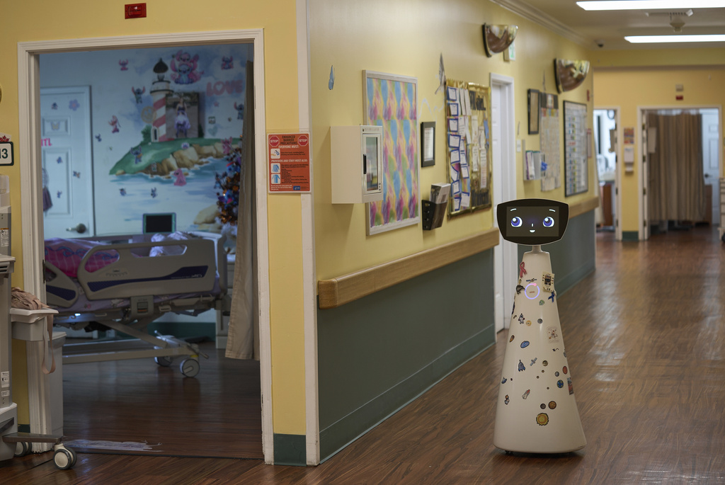  Robin the Robot, developed by Expper Technologies, visits patients' rooms at the HealthBridge Orange Specialty Pediatric Hospital in Orange, California, US. (AP)
